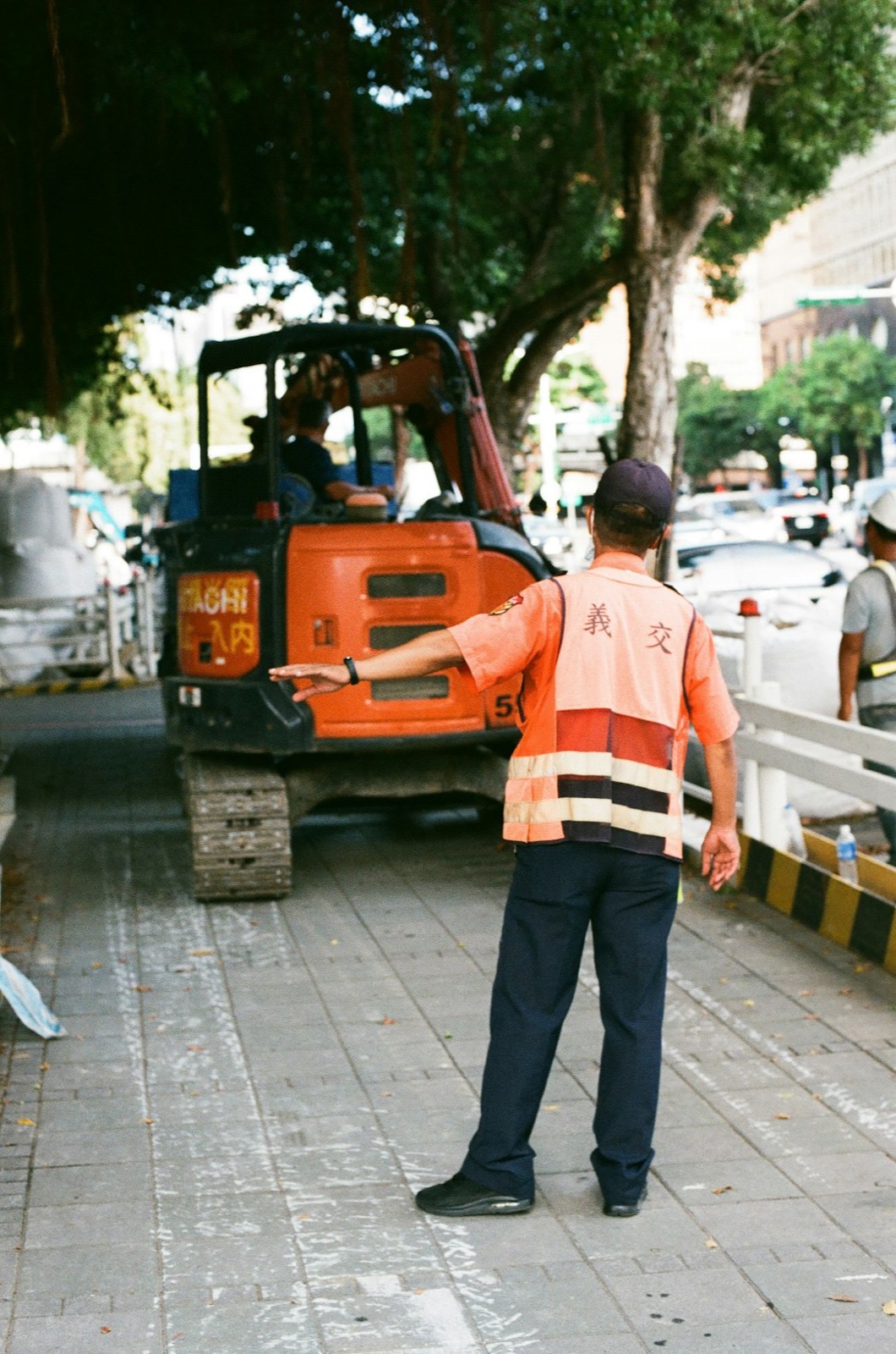 Rigger inspecting synthetic sling for damage